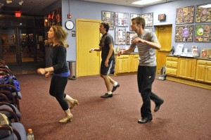 Sara Malloy (Janet Van de Graaf), Andrew Dameron (Robert Martin) and Garrett Ard (George) practice their moves in the lobby.