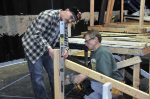 "Does this look level?" Pat Daly and Alan Bolds work on the "Full Circle" set.