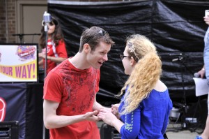 Garrett Ard (Romeo) and Nikki Wilson (Juliet) perform the titular characters' meeting during the R&J flashmob at the Taste of Wheaton.